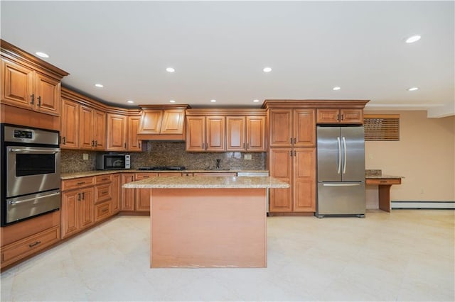 kitchen with a baseboard radiator, custom exhaust hood, light stone counters, a warming drawer, and stainless steel appliances