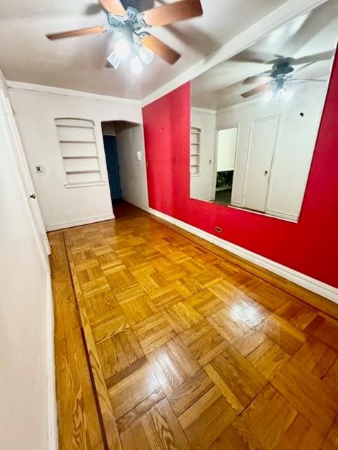 unfurnished bedroom featuring ceiling fan and light parquet flooring