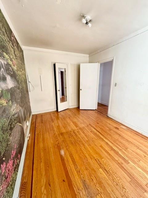 860 Grand Concourse Unit 4I, Bronx, NY 10451 - empty room with wood finished floors and crown molding