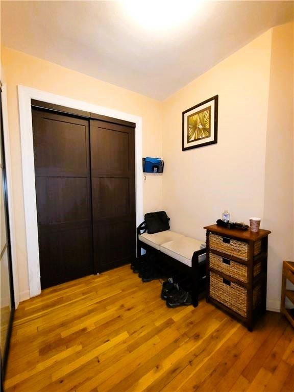 2400 E 3rd St Unit 406, Brooklyn, NY 11223 - bedroom with light wood finished floors and a closet
