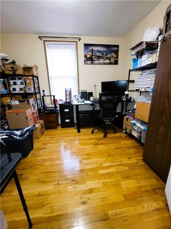 2400 E 3rd St Unit 406, Brooklyn, NY 11223 - home office with light wood-type flooring