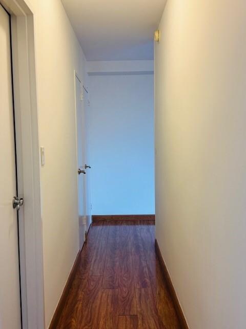 448 Neptune Ave Unit 19M, Brooklyn, NY 11224 - corridor with wood finished floors and baseboards