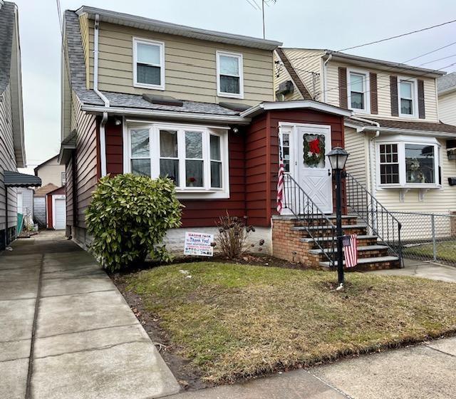 2156 Kimball St, Brooklyn, NY 11234 - view of front of property with an outdoor structure and a detached garage