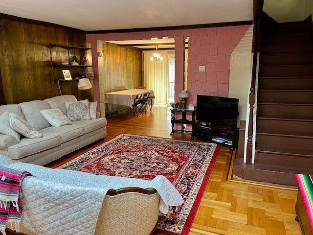 living room with wood walls