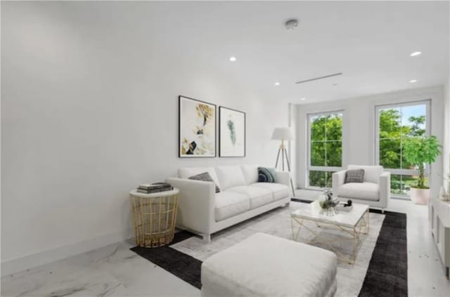 122 Palmetto St Unit 3L, Brooklyn, NY 11221 - living room with recessed lighting, marble finish floors, and baseboards