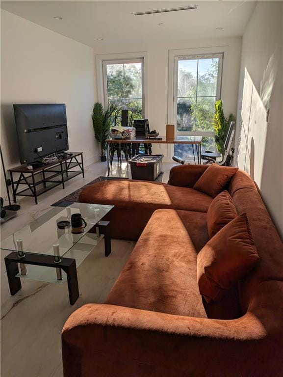 living room with a healthy amount of sunlight