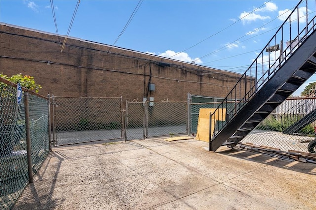 exterior space featuring fence and a gate