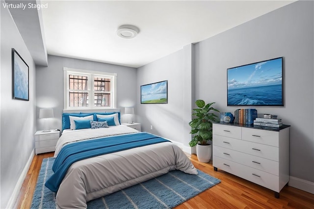 bedroom with light wood-type flooring