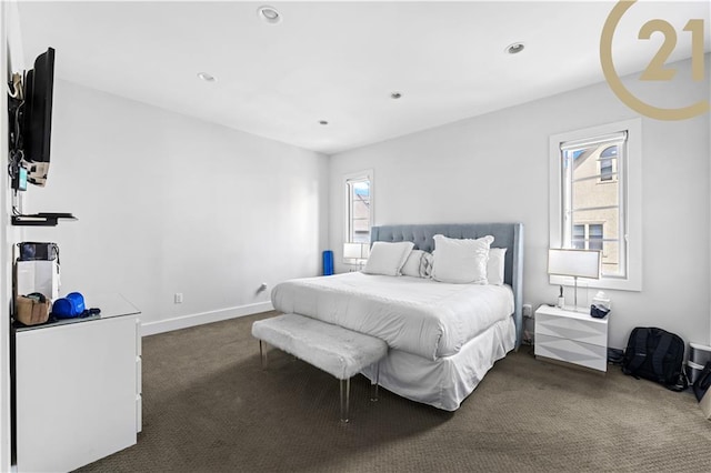 bedroom with baseboards, multiple windows, dark carpet, and recessed lighting