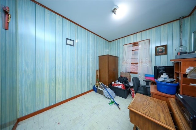 interior space with baseboards, ornamental molding, and tile patterned floors