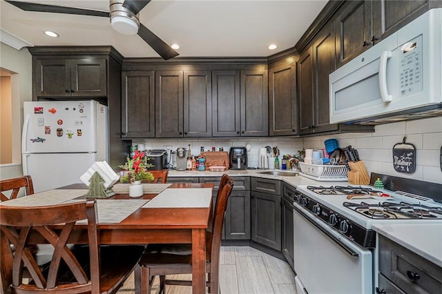 50 Bay 46th St, Brooklyn, NY 11214 - kitchen with white appliances, light countertops, ceiling fan, decorative backsplash, and recessed lighting