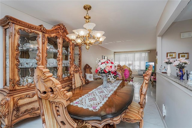 dining area featuring an inviting chandelier and tile patterned floors