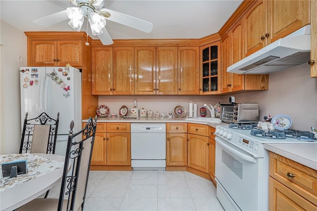 50 Bay 46th St, Brooklyn, NY 11214 - kitchen with white appliances, under cabinet range hood, and light countertops