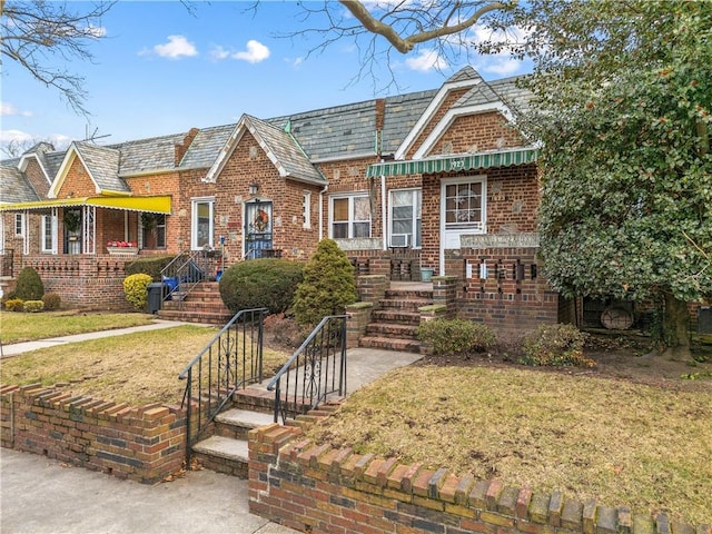 tudor-style house with a front lawn