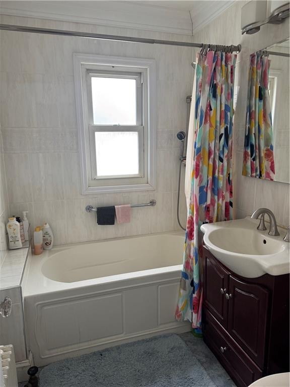 bathroom featuring radiator, crown molding, shower / tub combo, tile walls, and vanity