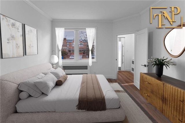 bedroom with ornamental molding and dark hardwood / wood-style floors