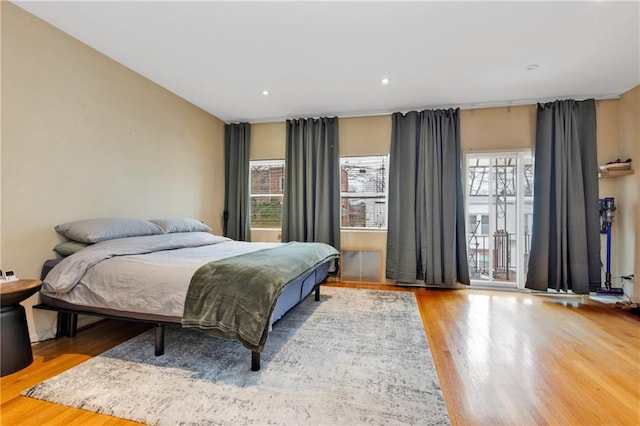 bedroom featuring recessed lighting and wood finished floors