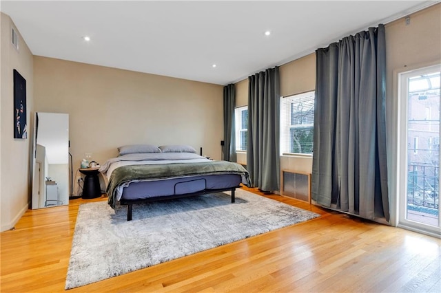 bedroom featuring visible vents, access to outside, light wood-style flooring, and recessed lighting