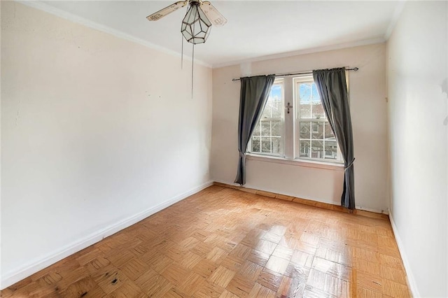 spare room featuring baseboards, a ceiling fan, and crown molding