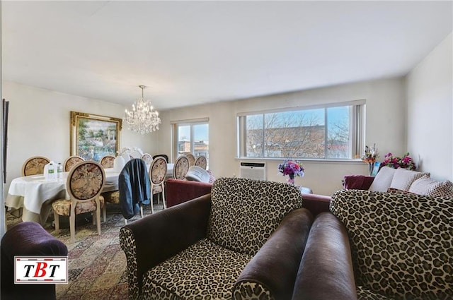 living room featuring an inviting chandelier, a wall unit AC, and a wealth of natural light