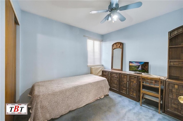 bedroom featuring ceiling fan and carpet