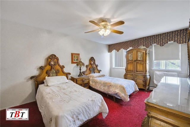 carpeted bedroom with a baseboard heating unit and ceiling fan