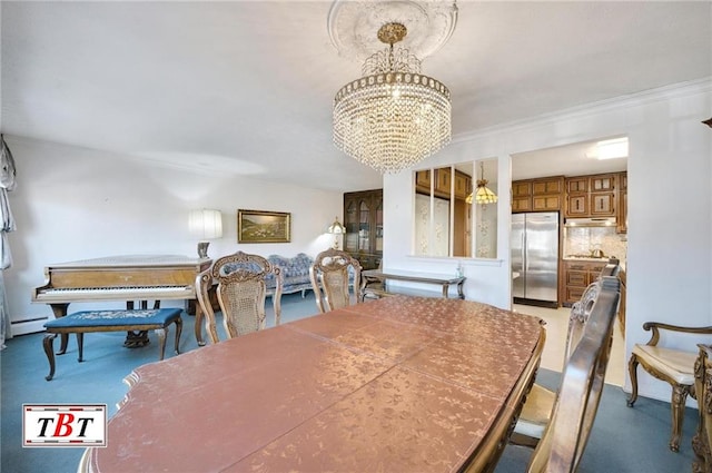 dining area with crown molding, a baseboard radiator, and a notable chandelier