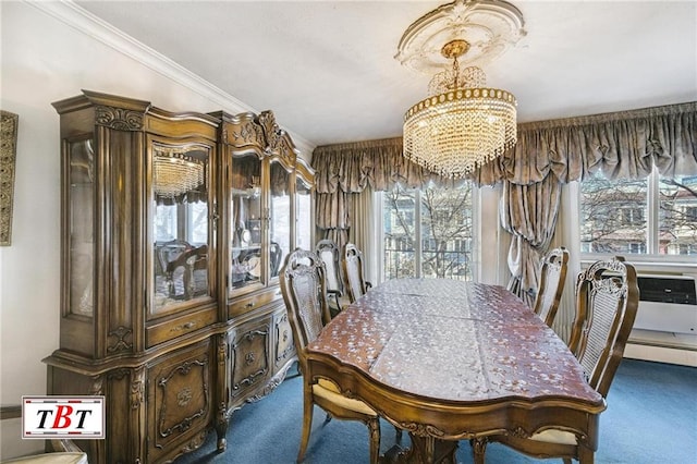 dining room featuring an inviting chandelier, dark carpet, and crown molding