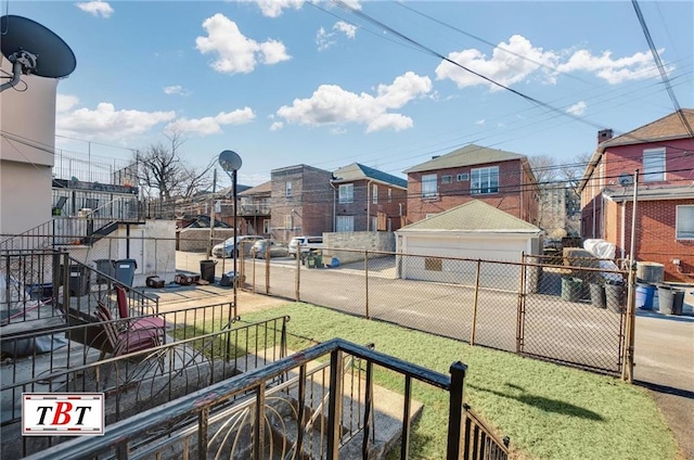 view of yard with a residential view and fence