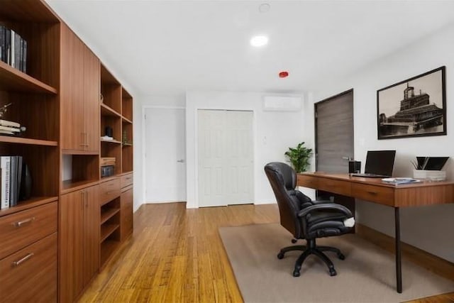 home office with light wood-style floors