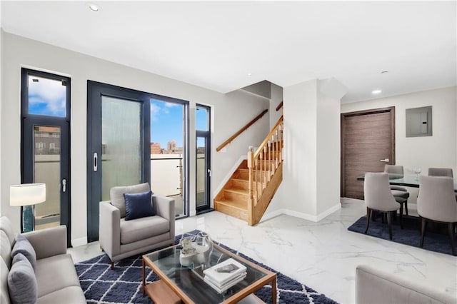 living area with stairs, electric panel, recessed lighting, and marble finish floor