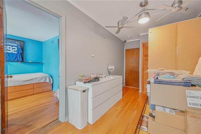 interior space with ceiling fan and light hardwood / wood-style floors