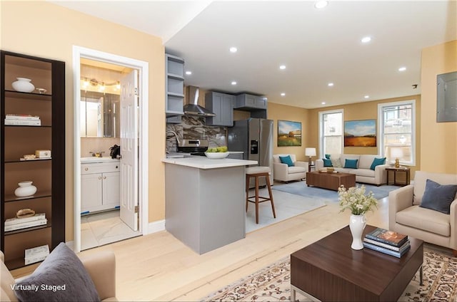 living room featuring recessed lighting and light wood-style flooring