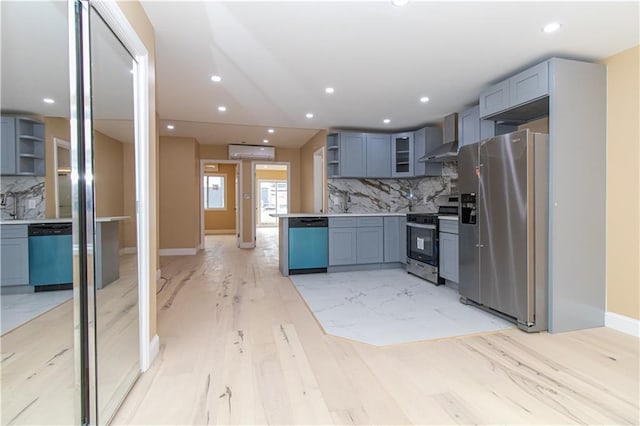 kitchen with open shelves, wall chimney range hood, backsplash, and appliances with stainless steel finishes