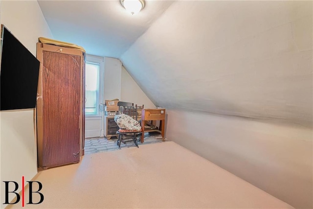 office featuring carpet and vaulted ceiling