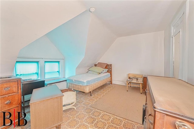 bedroom with vaulted ceiling