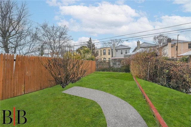 view of yard with a fenced backyard