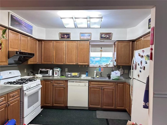 kitchen with sink and white appliances