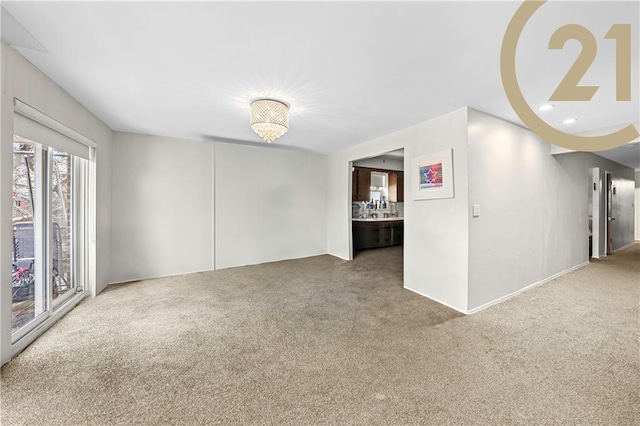 1736 E 7th St, Brooklyn, NY 11223 - carpeted spare room featuring a chandelier