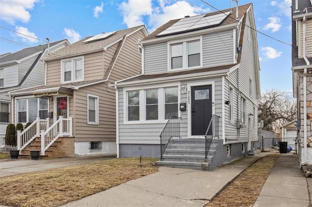 view of front of home with solar panels