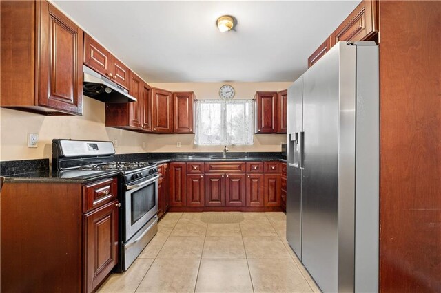 kitchen featuring sink, stainless steel appliances, and light tile patterned flooring