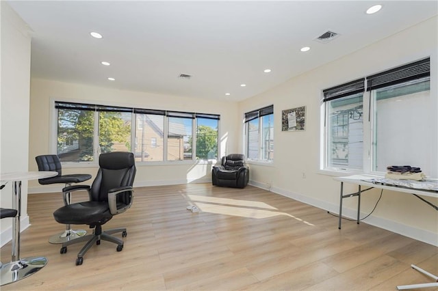 office with baseboards, light wood finished floors, visible vents, and recessed lighting