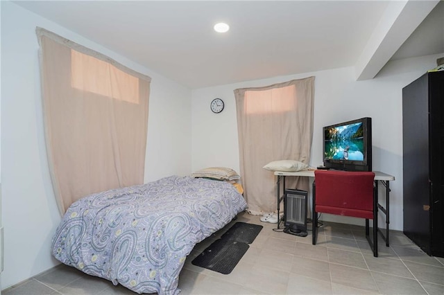 tiled bedroom with recessed lighting