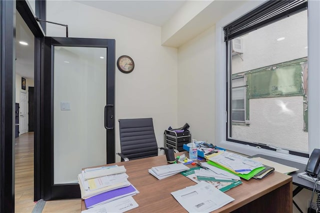 office with light wood-type flooring