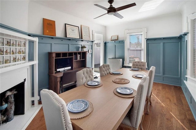 dining room featuring dark hardwood / wood-style floors and ceiling fan