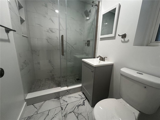 bathroom featuring marble finish floor, vanity, a marble finish shower, and toilet