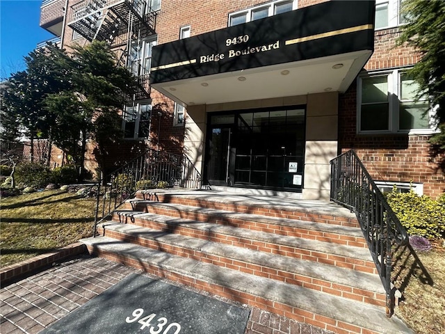 property entrance with brick siding