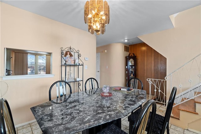 dining room with visible vents, baseboards, stairs, and an inviting chandelier