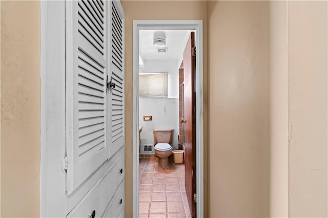 hallway featuring light tile patterned floors