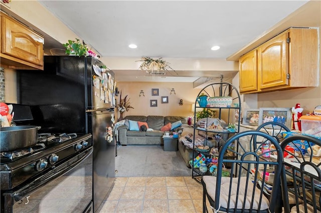 kitchen with black gas range oven, light tile patterned floors, recessed lighting, and open floor plan